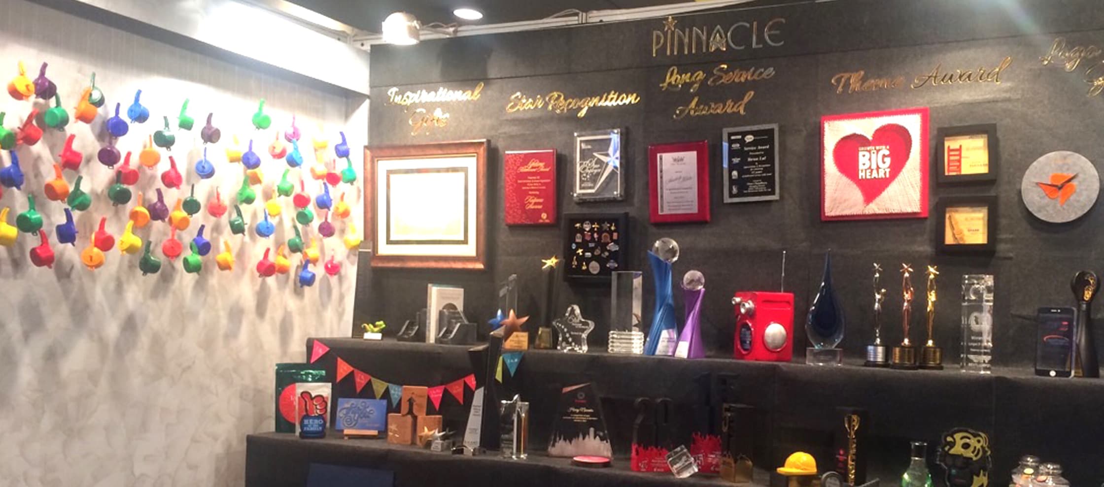 Products of Pinnacle Works displayed at an Exhibition booth beautifully