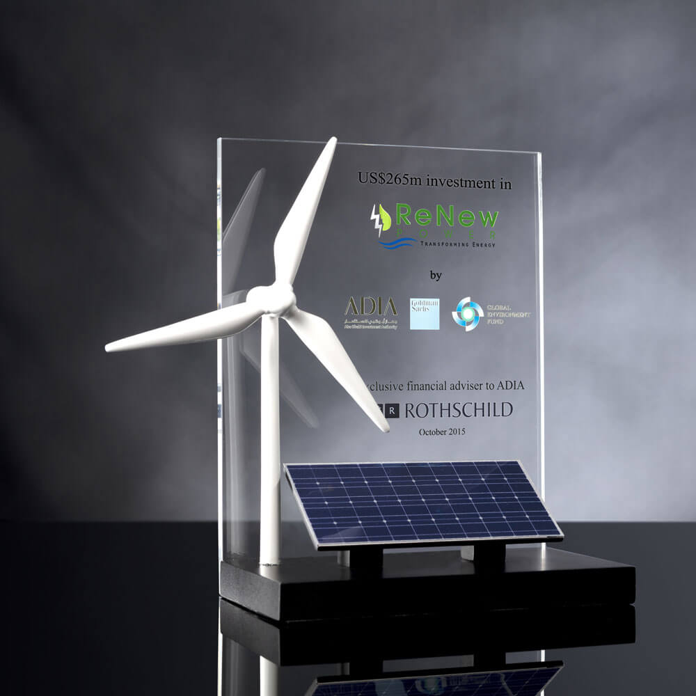 A wind turbine and solar panel on a stand, representing renewable energy source financial tombstone.