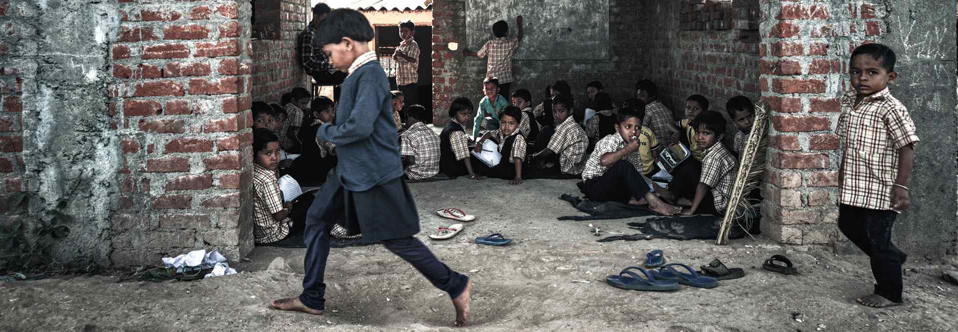 A boy leading a group of children
