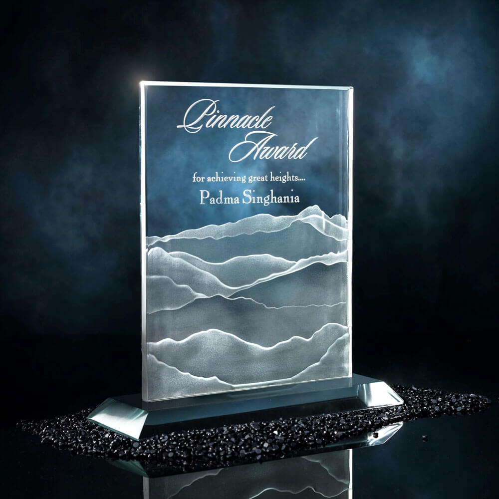 White Glass Award in a rectangle shape and a base with text Pinnacle Award deeply engraved