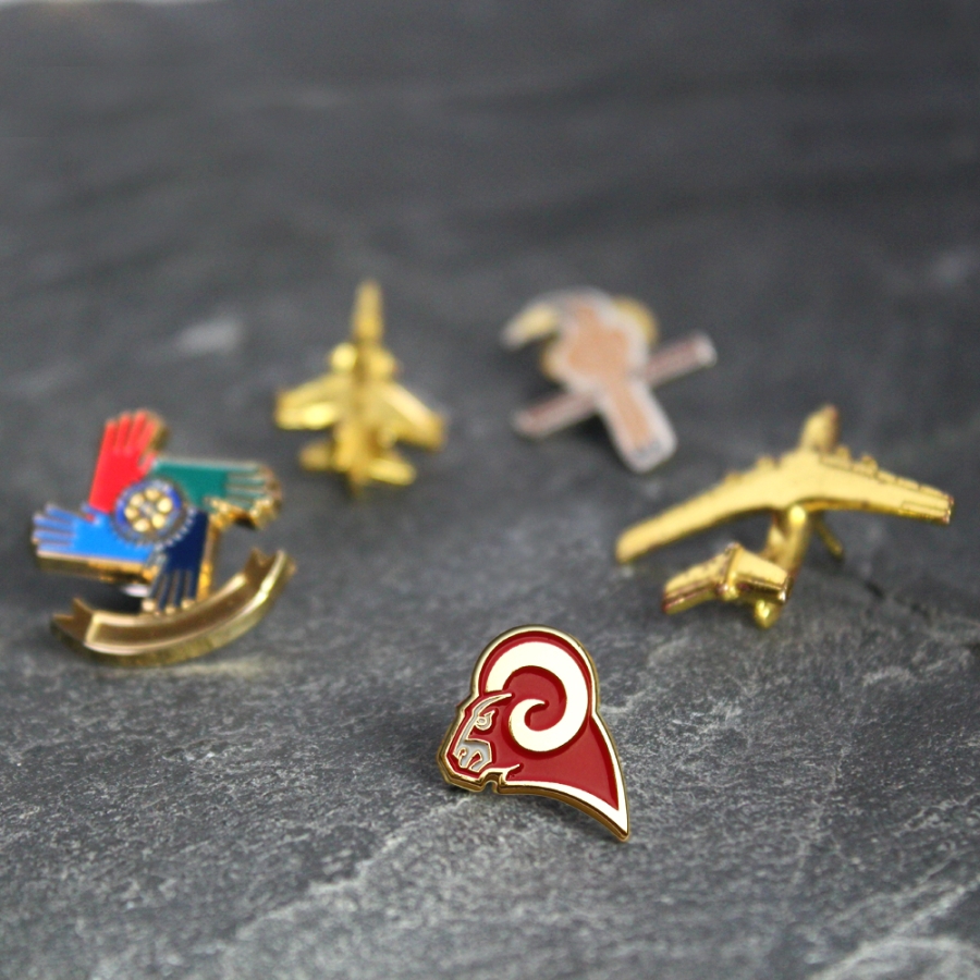 A set of five pins featuring a patriotic red, white, and blue design.