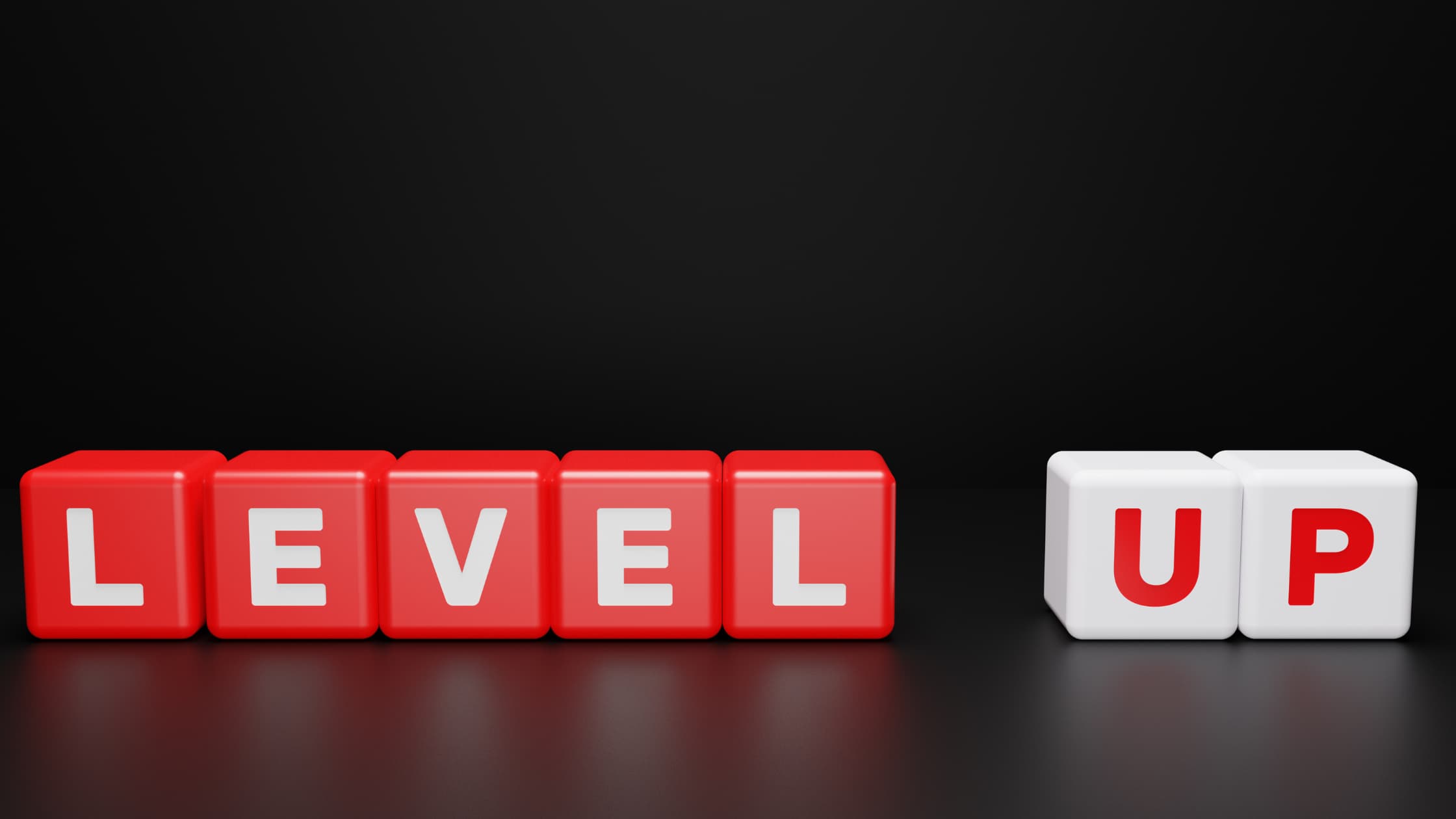 Red and white cubes with "level up" text on a black background.