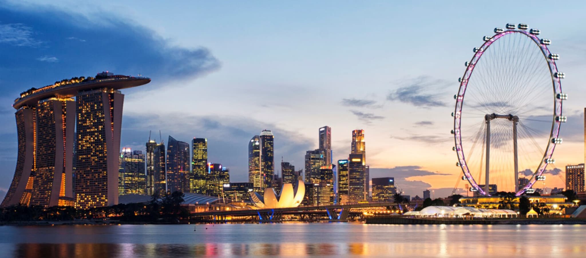 The marina bay sands skyline at dusk in Singapore.