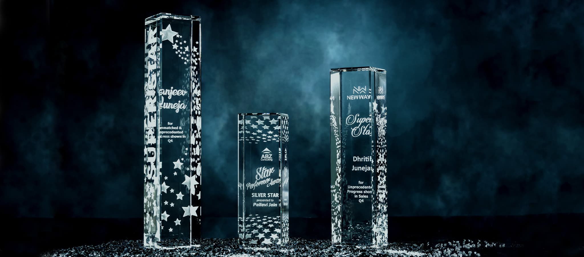 Shimmering crystal awards against black backdrop